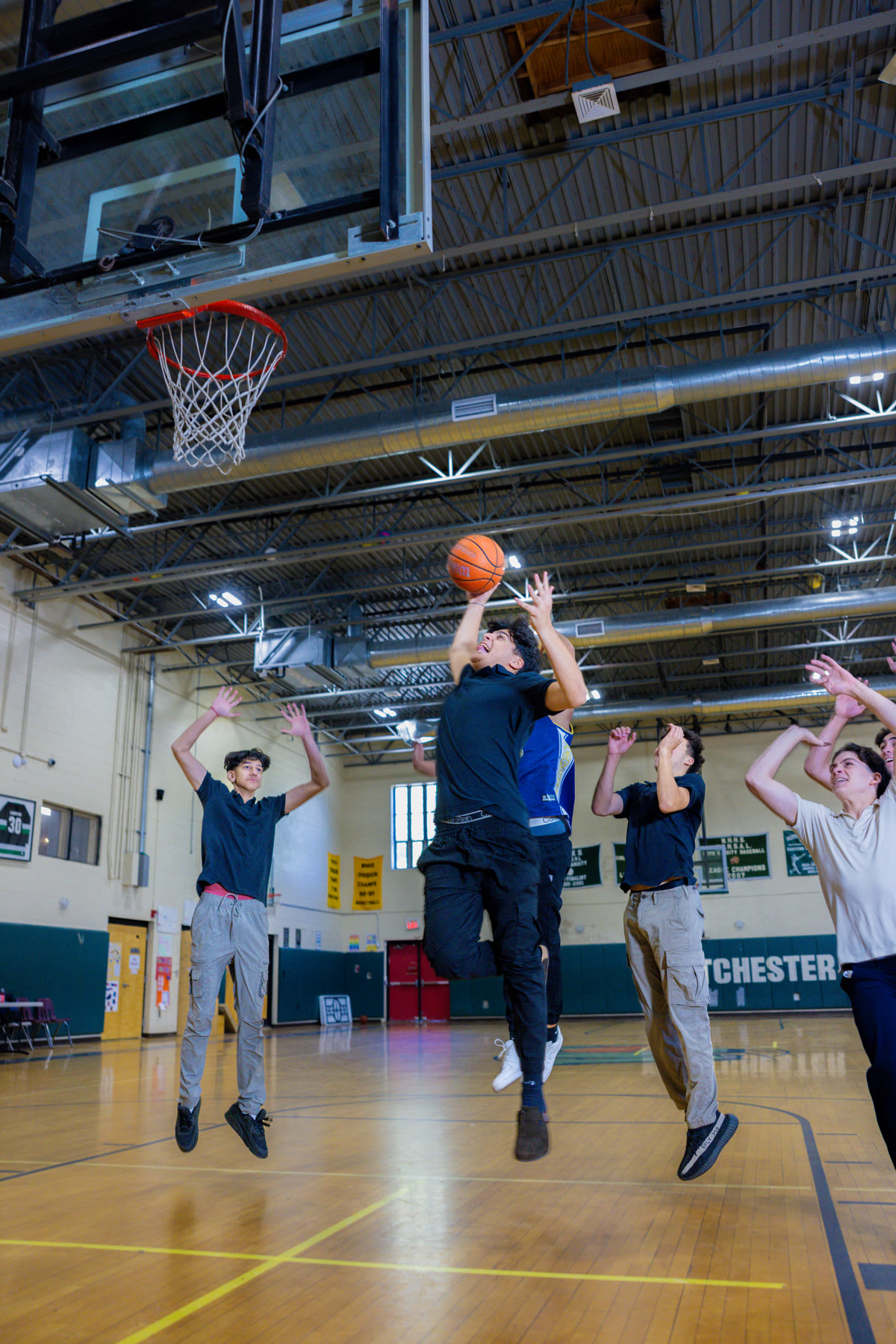 WHHS students playing basketball in the gym