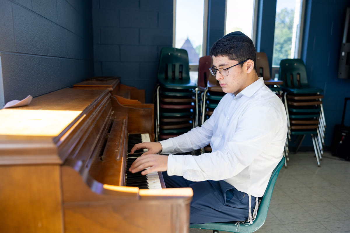 A WHHS student playing the piano